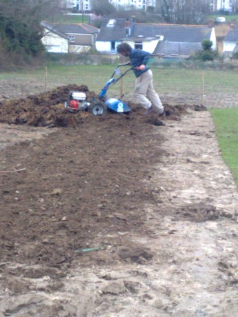 Russell battling the rotovator and the 'great heap'