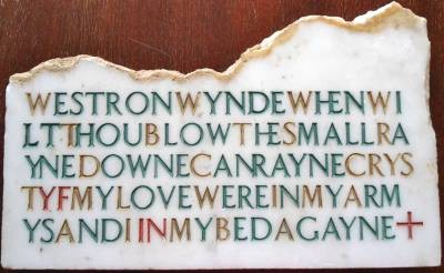 The photo is of a piece of artwork on marble done by Christina Fletcher, the poem etched without wordbreaks and without lin